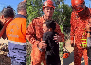 "Ele tá vivo!": emocionada, tutora abraça bombeiros após resgate de cachorro em bueiro