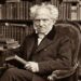 Frase de Arthur Schopenhauer sobre paixão: "O desejo veste a realidade com as cores que o coração escolhe." Uma reflexão sobre desejo, ilusão e percepção