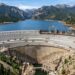 Gross Dam recebe novas camadas de concreto sobre a estrutura existente para aumentar sua altura.